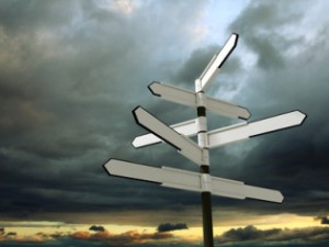 Image of blank signpost over dramatic sky